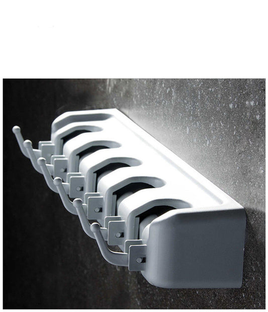 Multifunctional broom storage rack